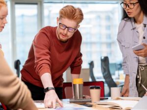A Chief People Office with his work colleagues discussing HR and people matters