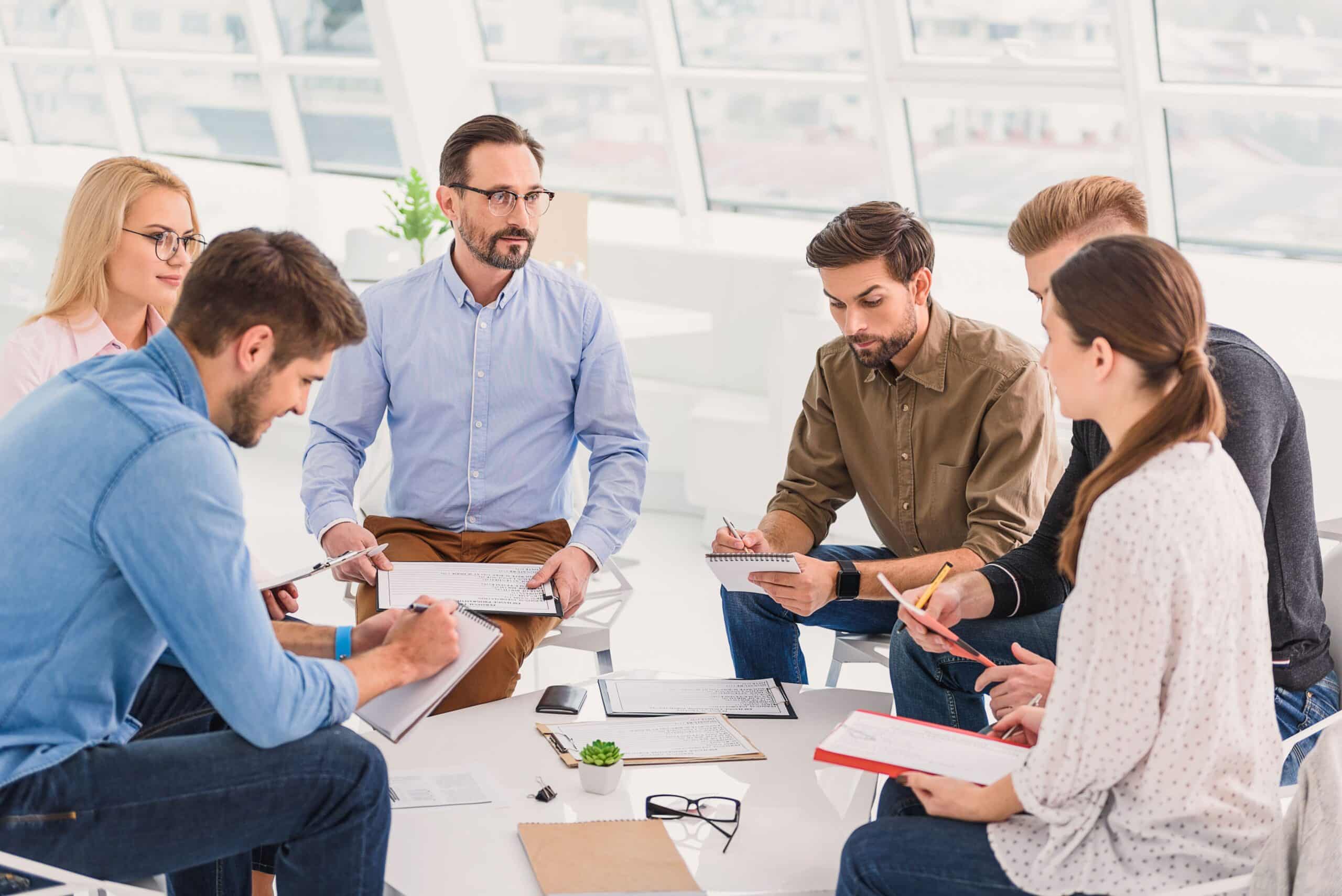 A group of people in a modern office having a meeting